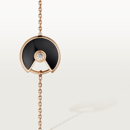 CARTIER CURB CHAIN BLACK ONYX ROSE GOLD AMULET